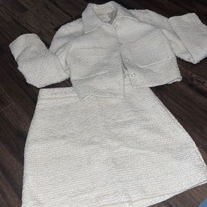 Tweed skirt set with rhinestone buttons on jacket